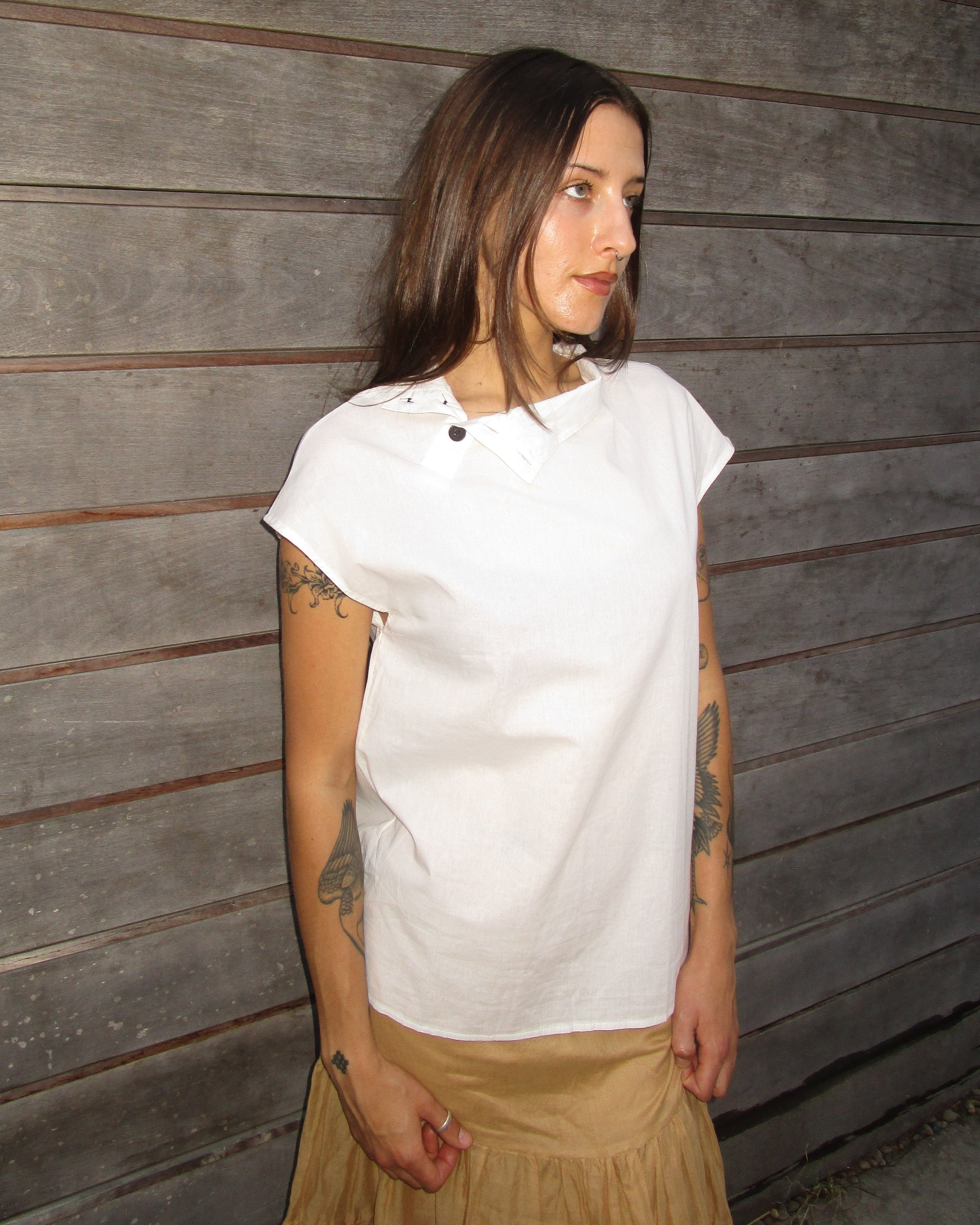 high neck asymmetrical button top