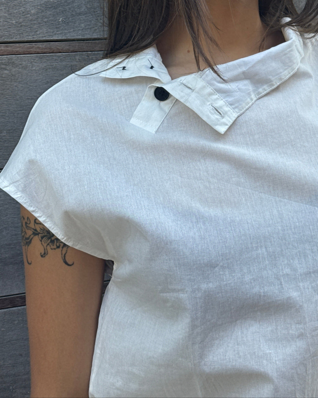 high neck asymmetrical button top